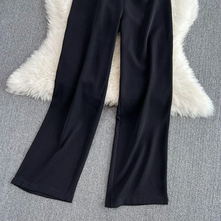 Lisa Offshoulder Jumpsuit - close-up of trouser hem, black - Miss Mosa By Akanksha