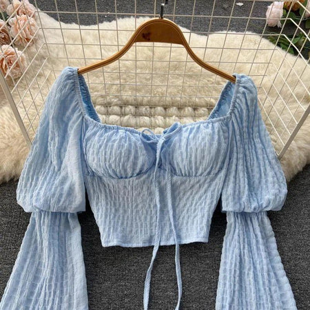 Lyra Statement Top - front shot on hanger, blue - Miss Mosa By Akanksha