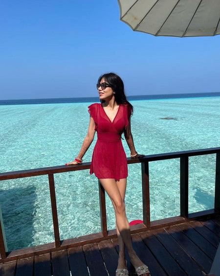 Soneva Holiday Swimsuit - lifestyle shot on model, red - Miss Mosa By Akanksha