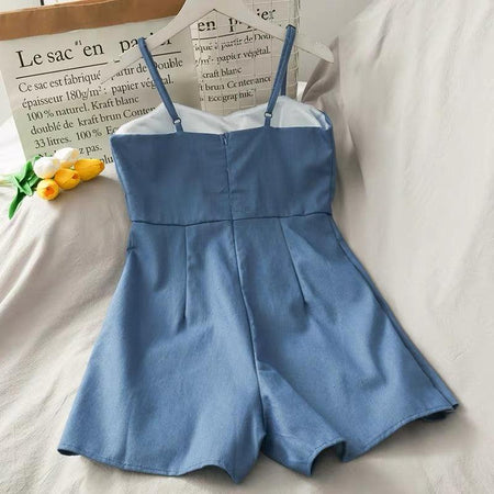 Suzie Denim Romper - back shot on hanger, blue - Miss Mosa By Akanksha