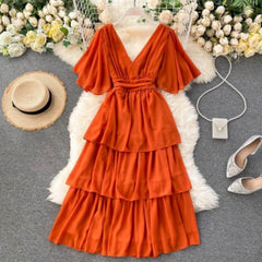 Taurel Flutter Sleeve Dress - front shot on hanger, orange - Miss Mosa By Akanksha