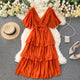 Taurel Flutter Sleeve Dress - front shot on hanger, orange - Miss Mosa By Akanksha